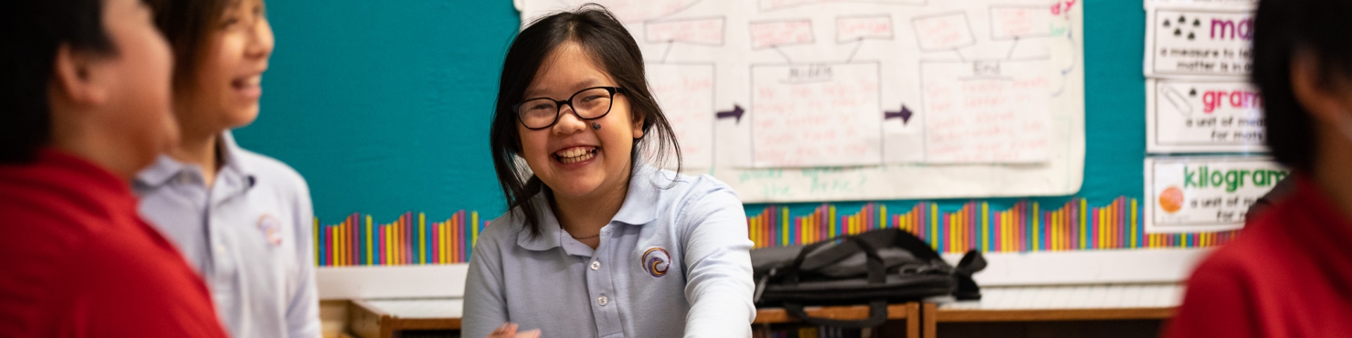 a girl smiling at the camera